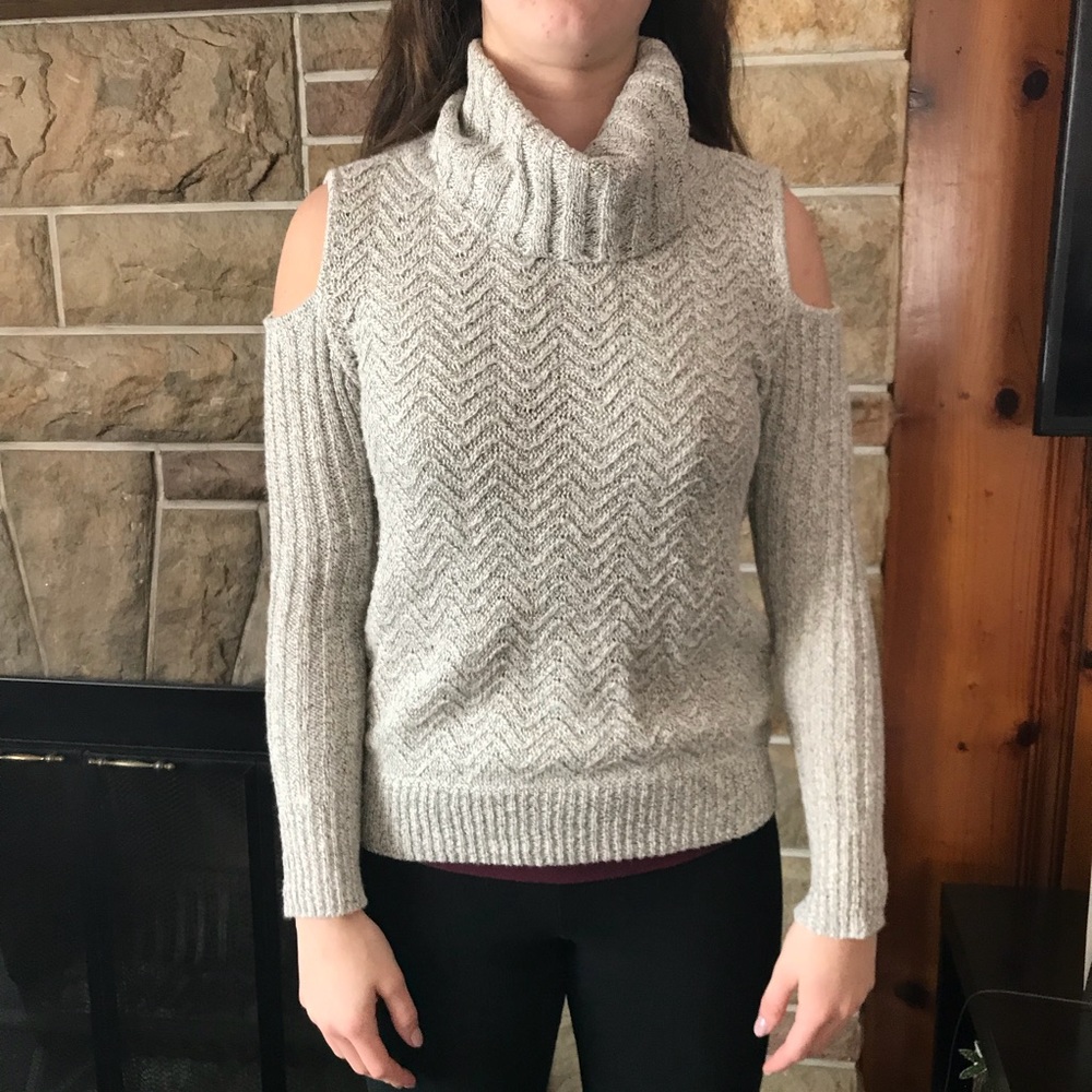 Turtle neck sweater with cut outs in shoulder